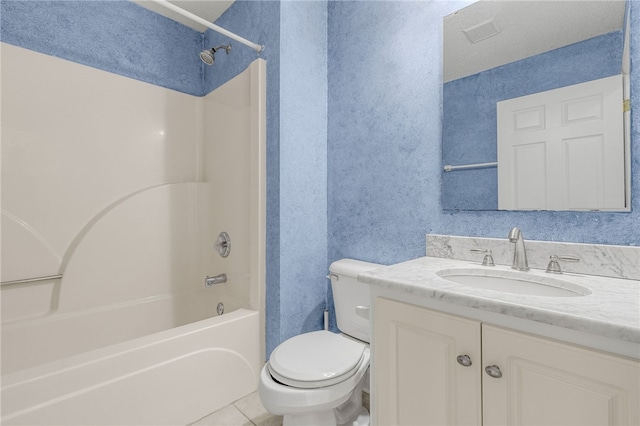 full bathroom with toilet, vanity,  shower combination, and tile patterned floors