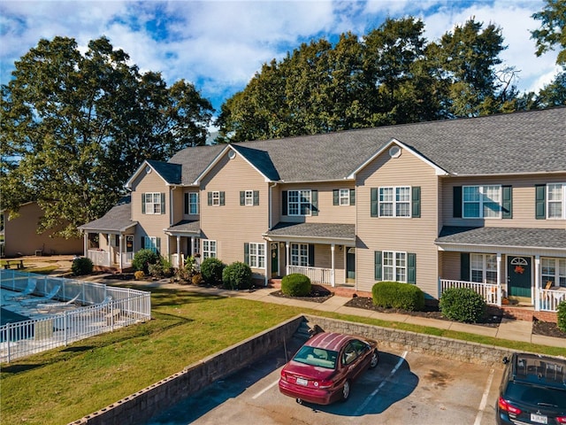 view of front of house featuring a porch and a front yard