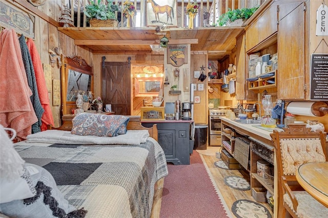 bedroom with light wood-type flooring, wooden ceiling, sink, and wood walls