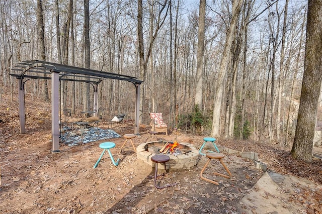 view of yard with a fire pit