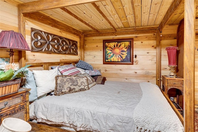 bedroom with wooden ceiling, carpet flooring, and wood walls