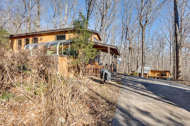 view of front of property featuring a sunroom