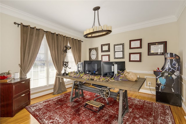 office space with light wood-type flooring and ornamental molding