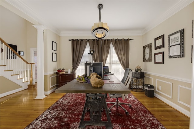 office featuring decorative columns, ornamental molding, and hardwood / wood-style floors