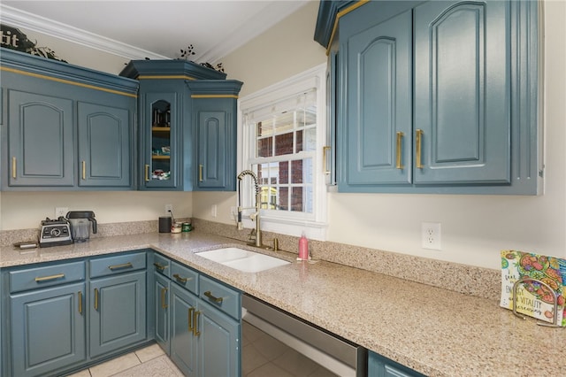 kitchen featuring light tile patterned floors, dishwashing machine, blue cabinetry, ornamental molding, and sink