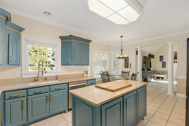 kitchen with ornate columns, light tile patterned floors, sink, dishwasher, and a center island