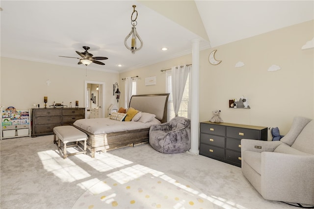 bedroom featuring lofted ceiling, ornate columns, ceiling fan, light colored carpet, and crown molding