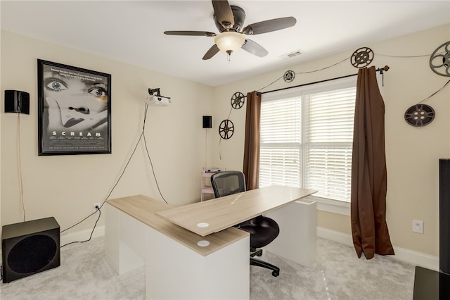 office space featuring ceiling fan and light colored carpet