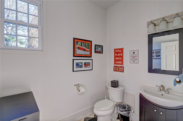 bathroom featuring toilet and vanity