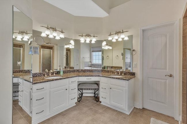 bathroom with tile patterned floors and vanity