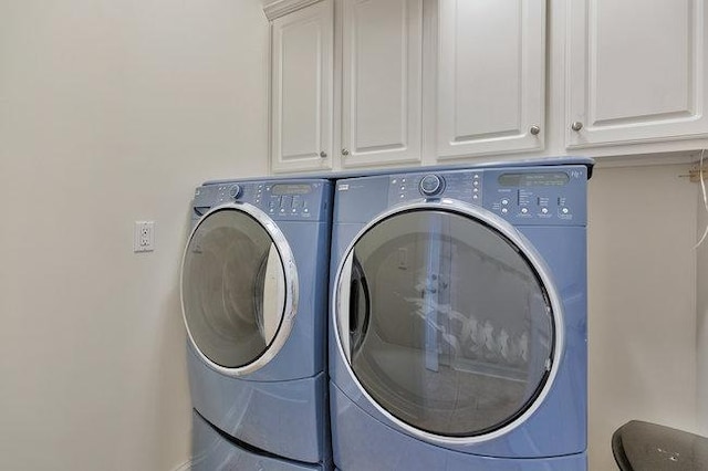 laundry area with cabinets and washer and dryer