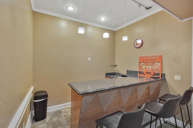 bar with decorative light fixtures, crown molding, and dark stone counters