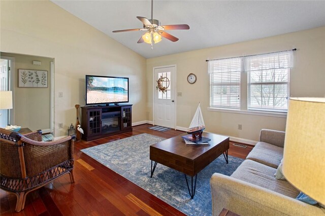 living room featuring dark hardwood / wood-style floors, ceiling fan, and lofted ceiling