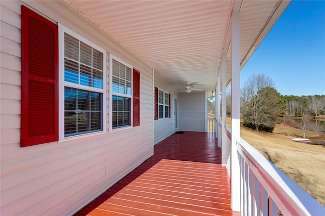 deck with ceiling fan and a porch