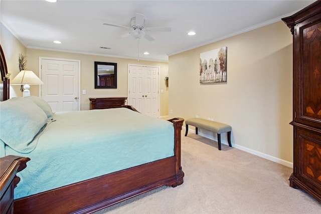 bedroom featuring visible vents, ornamental molding, baseboards, and light colored carpet