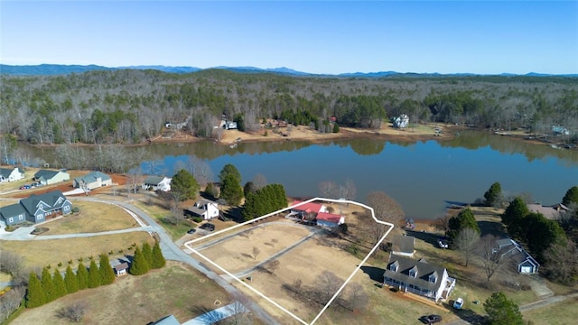 bird's eye view with a forest view and a water and mountain view