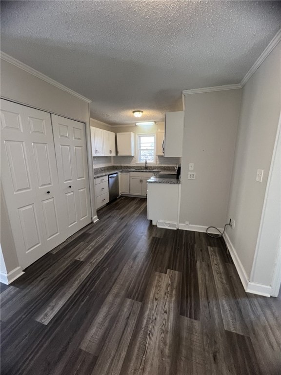 kitchen with a textured ceiling, dark wood-type flooring, sink, dishwasher, and white cabinetry