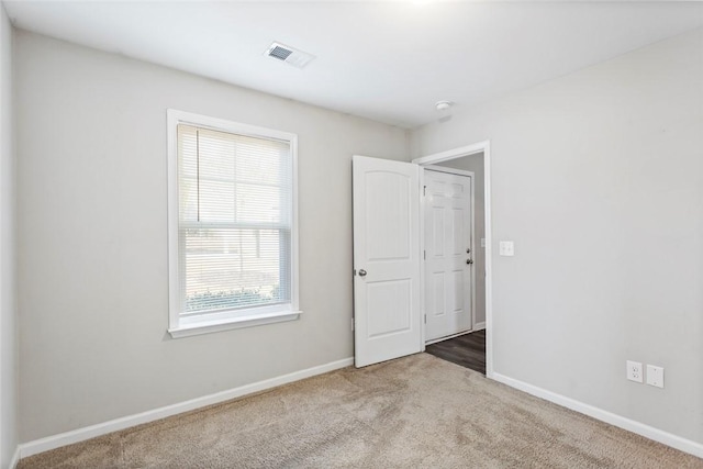 view of carpeted spare room