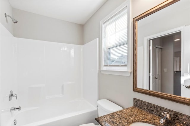 full bathroom featuring shower / bathing tub combination, vanity, toilet, and a wealth of natural light