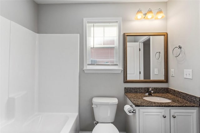 full bathroom featuring bathing tub / shower combination, vanity, and toilet