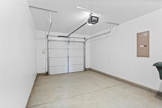 garage featuring electric panel and a garage door opener