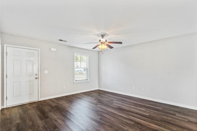 unfurnished room featuring dark hardwood / wood-style floors and ceiling fan