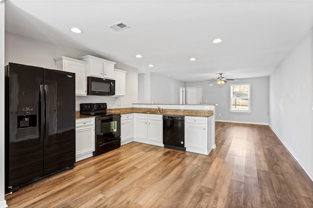 kitchen featuring black appliances, kitchen peninsula, light hardwood / wood-style flooring, ceiling fan, and white cabinetry