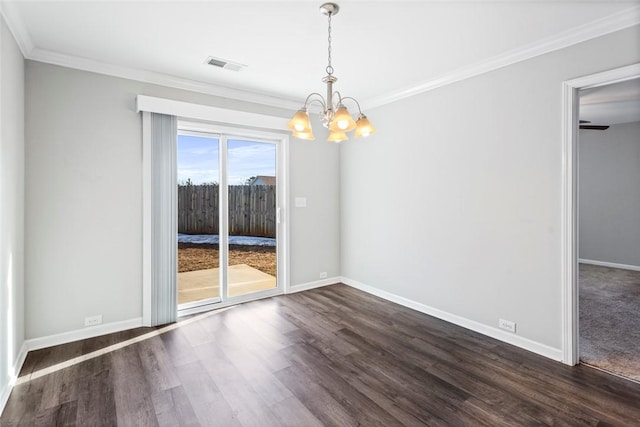 unfurnished dining area with dark wood-type flooring, an inviting chandelier, and ornamental molding