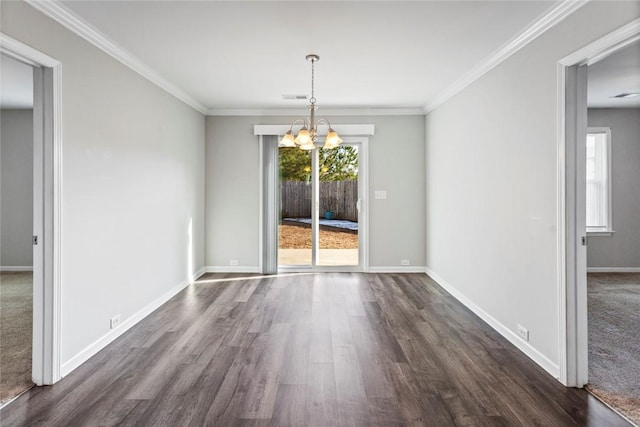 unfurnished dining area with dark wood-type flooring, a chandelier, and ornamental molding