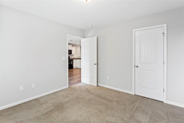 unfurnished bedroom featuring carpet flooring