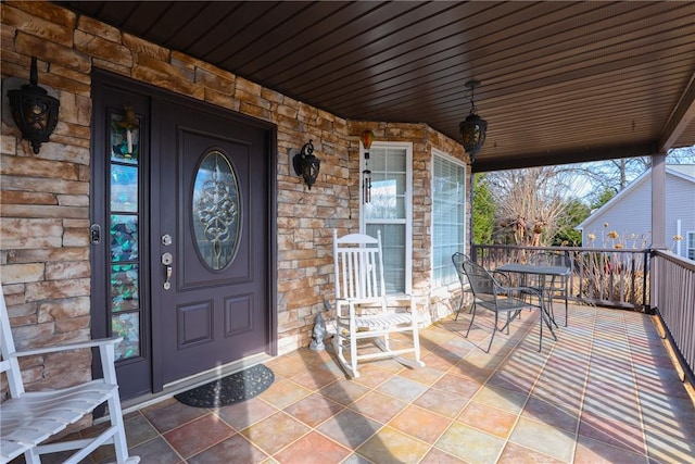 doorway to property featuring covered porch