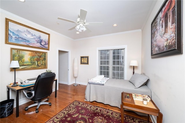 bedroom featuring ceiling fan, hardwood / wood-style flooring, and ornamental molding