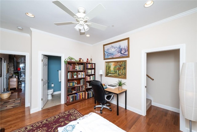 office with ornamental molding, dark hardwood / wood-style flooring, and ceiling fan