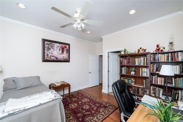 office featuring hardwood / wood-style floors, ceiling fan, and crown molding