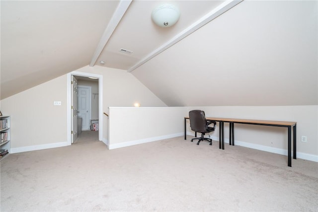 carpeted home office with lofted ceiling