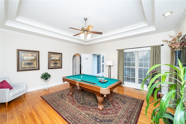 rec room featuring hardwood / wood-style floors, pool table, crown molding, ceiling fan, and a tray ceiling