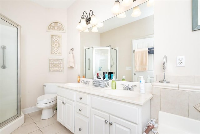 bathroom with vanity, a shower with door, tile patterned flooring, and toilet