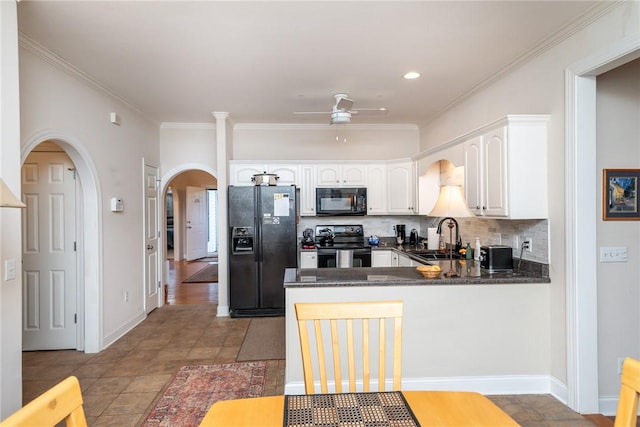 kitchen featuring white cabinetry, ornamental molding, black appliances, and kitchen peninsula