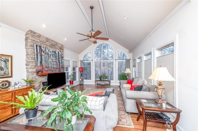 sunroom / solarium with ceiling fan, a wealth of natural light, and lofted ceiling