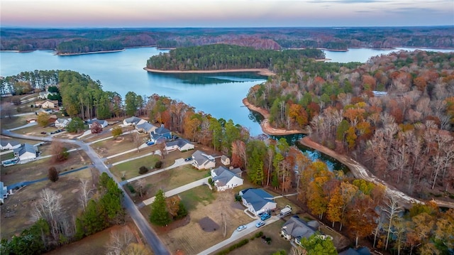 aerial view at dusk with a water view