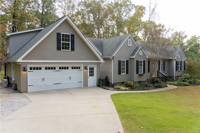 view of front of home with a front yard and a garage