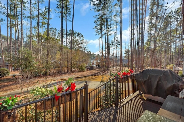 wooden terrace featuring area for grilling