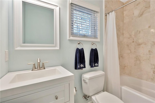 full bathroom featuring shower / bath combination with curtain, vanity, and toilet