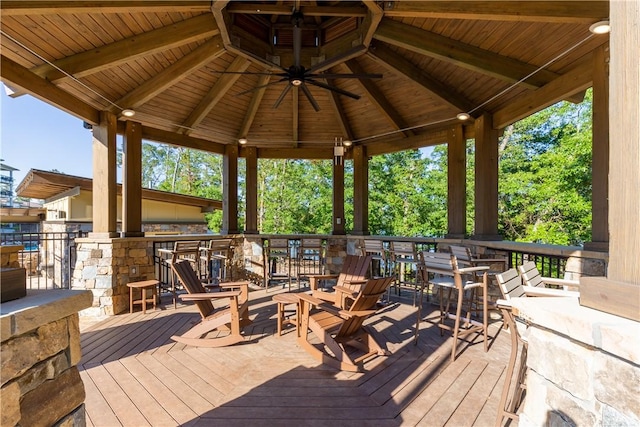 wooden deck featuring a gazebo and ceiling fan