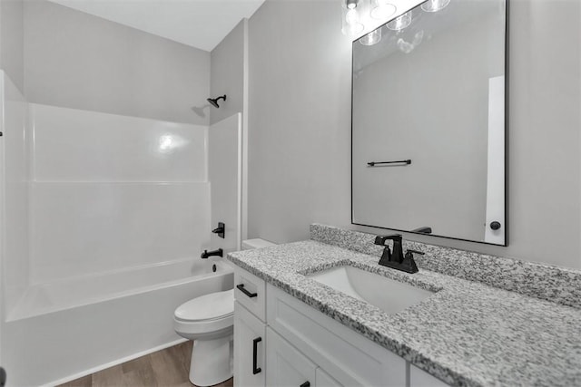 full bathroom with toilet, vanity, shower / tub combination, and hardwood / wood-style flooring