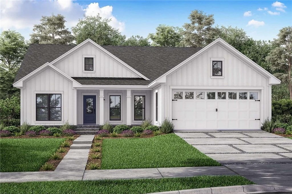 modern inspired farmhouse with a front lawn and a garage