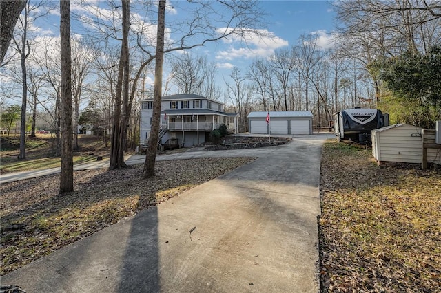 view of property exterior with a garage and an outdoor structure