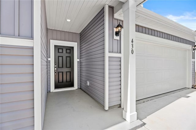 entrance to property featuring a garage