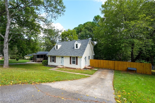 new england style home featuring a front lawn