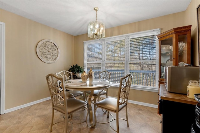 dining area with a notable chandelier